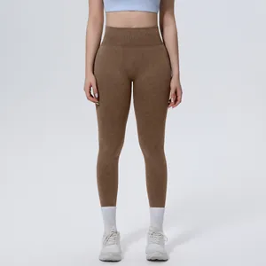 Close-up detail of high waist brown washed seamless yoga pants on fitness model