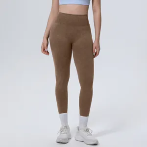 High-waisted seamless brown yoga leggings for women shown in a full-length studio view