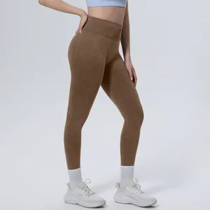 Side view detail of high-waist seamless washed brown yoga leggings for women