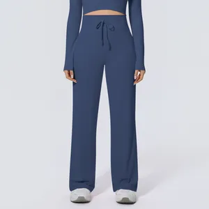 Detailansicht der hoch taillierten Yoga-Hose mit weitem Bein und Kordelzug in Dunkelblau
