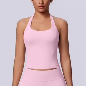 Professional close-up of a pink halter-neck seamless sports tank top for yoga and fitness