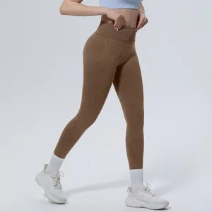 Close-up view of high-waist seamless washed yoga leggings for women in coffee color