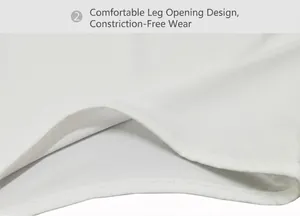 Close-up detail of the smooth leg opening on a white long sleeve stretch bodysuit.