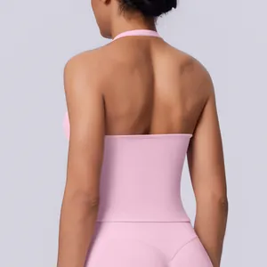 Close-up detail view of a pink seamless halter neck sports top showing elegant back design