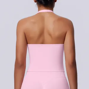 Back view of a seamless pink halter sports tank top for yoga and fitness.