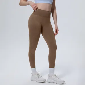 High-waist seamless yoga leggings in brown showing tummy control and fabric texture.