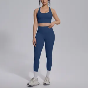 Detailed view of navy blue two-piece yoga set with sports bra and high-waist leggings