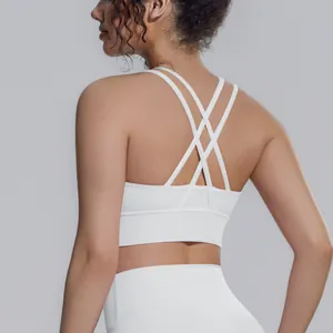 Vista posteriore di un reggiseno sportivo bianco con spalline incrociate per yoga e fitness