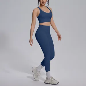 Two-piece deep blue yoga set featuring a sports bra and high-waisted gym leggings