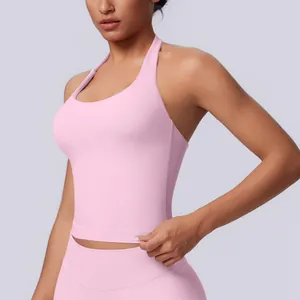 Detail view of a seamless pink halter-neck sports top for yoga and fitness workout
