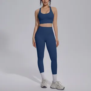 Professional fit of navy blue high-waisted yoga leggings and bra set for fitness.