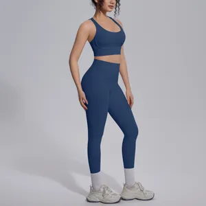 Side view of navy blue two-piece yoga set featuring a sports bra and high-waist leggings
