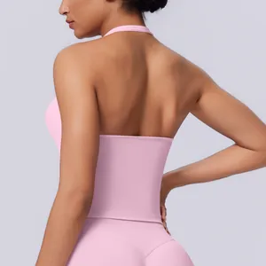Detail view of pink seamless halter-neck sports tank top with backless design for yoga