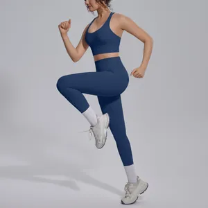 Dynamic side view of a model wearing a navy blue nylon yoga set while running