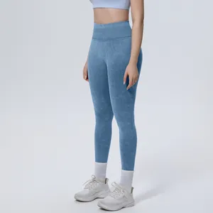 Detail of high-waisted seamless washed blue yoga leggings for women fitness and running