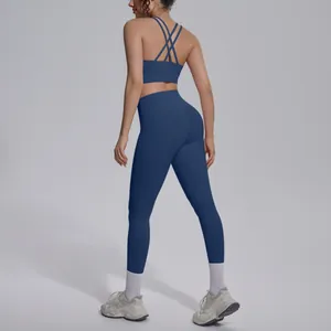 Navy blue double-sided nylon yoga suit with cross-back sports bra and tight leggings