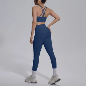 Detail view showing the criss-cross back design and fit of the navy blue yoga set