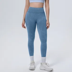 Close-up of seamless washed yoga leggings with high-waisted ribbed tummy control band.
