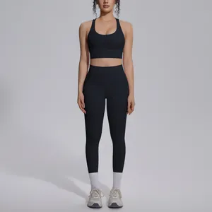 Front view of a black two-piece yoga set with sports bra and high-waist leggings