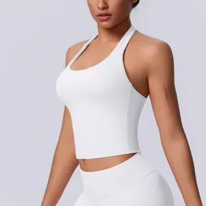 Close-up of white seamless halter neck sports bra with ribbed texture for yoga and fitness.