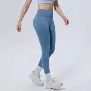 Seamless high-waisted yoga leggings with vintage washed texture in blue shown in detail