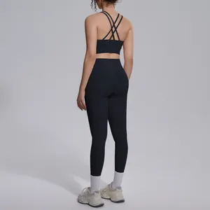 Detailed back view of a black criss-cross back sports bra and high waist leggings yoga set