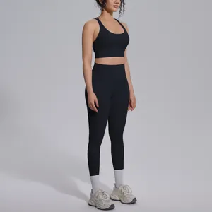 Professional view of black nylon yoga set with high-waisted leggings and sports bra