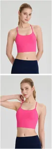 Professional close-up of a pink breathable yoga bra with slim straps and padded support