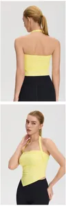 Front and back view of a yellow halter yoga tank top with asymmetrical hem and pads