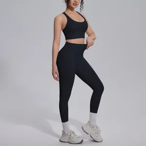 Women's black solid color yoga set with sports bra and high-waist leggings for fitness
