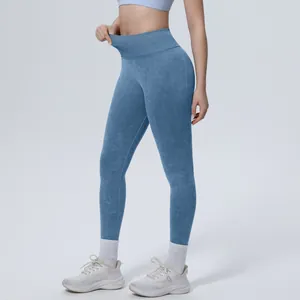 Detail view of high waist acid-wash seamless yoga leggings with tummy control