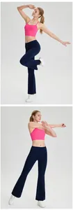 Professional side view of pink cross-back sports bra and navy flared yoga leggings on model