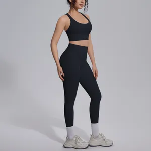 Detailed side view of black cross-back sports bra and high-waist yoga leggings set