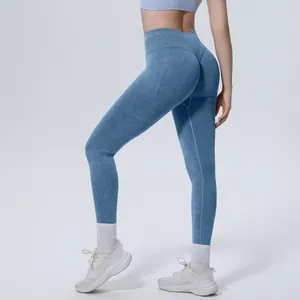 Close-up of blue seamless washed yoga leggings showing high-waist hip-lifting detail.