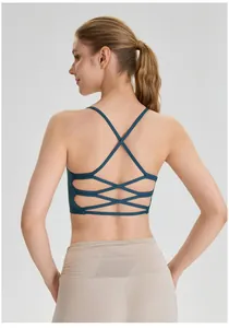 Back view of a teal criss-cross sports bra designed for yoga and gym fitness