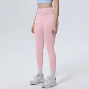 Detailed view of pink high-waisted seamless yoga pants with a breathable and body-shaping fit.
