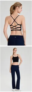 Professional back view of black sports bra with criss-cross straps and navy yoga pants