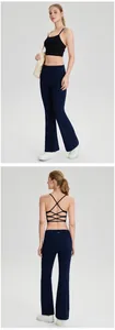Full view and back detail of black criss-cross sports bra with navy yoga flare pants