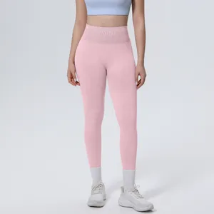 High-waisted pink seamless yoga leggings for women's professional fitness and running.