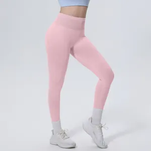 Detail view of pink seamless high waist yoga leggings for women in a fitness setting