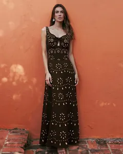 Elegant brown laser-cutout maxi swimsuit dress featuring intricate floral eyelet details