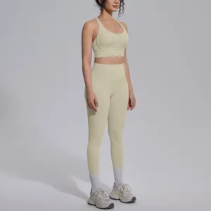Detailed side view of high-waist yoga leggings and matching sports bra in cream