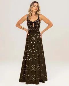 Close-up view of the intricate laser-cut floral pattern on this black maxi cover-up.