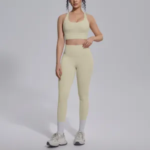 Detailed view of cream yoga set featuring a cross-back sports bra and high-waisted leggings