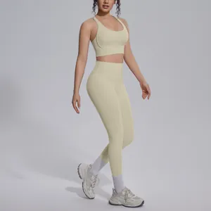 High-quality pale yellow seamless two-piece yoga set featuring sports bra and leggings