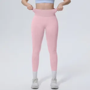 Close-up of pink high-waisted seamless yoga leggings with elastic waistband detail