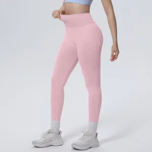 Close-up of pink high-waisted seamless yoga pants showcasing tummy control fit.