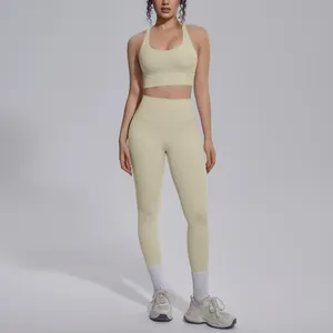 Full-body view of a beige nylon sports bra and high-waisted yoga leggings set on model
