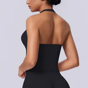 Seamless black halter neck sports tank top for women showing back details in studio