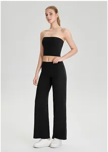 Dames zwarte strapless sporttube top met yoga broek met hoge taille en wijde pijp
